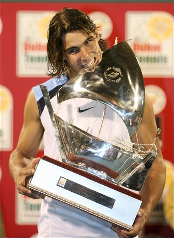 rafael nadal with trophy - rafael nadal biting his trophy. ^__^;;