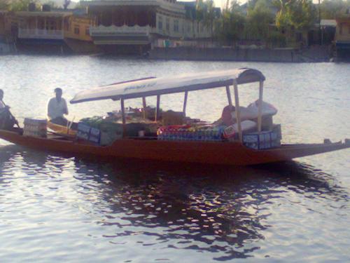 the boats that sell everything - shikara boats on waters