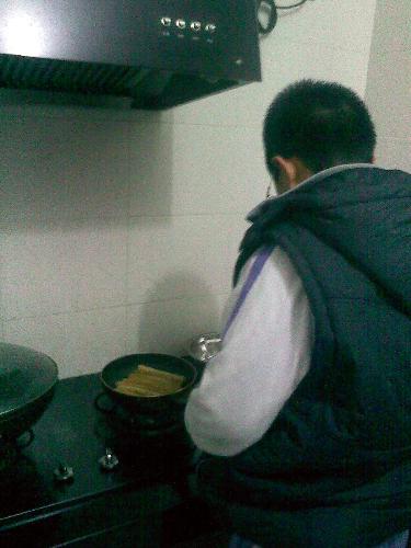 Fried sausages  - A Chinese boy in Fried sausages. Sausage is a child is very like to eat food.