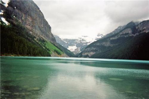 Lake Louise - Lake Louise, Banff, Alberta It was mid June and overcast when we decided to pack the car and head to Lake Louise! We had just moved to Alberta and had never seen the vastness of the Rocky Mountains! Despite the cooler temperatures, we were in complete awe!