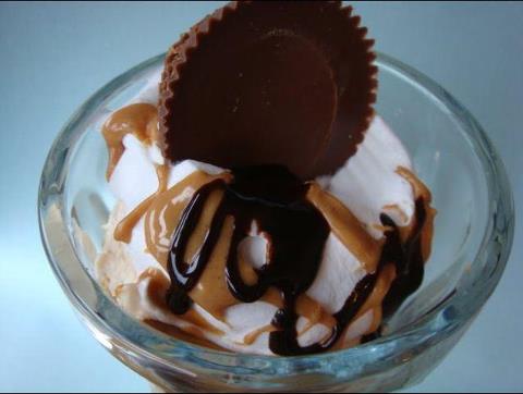 Reese's on top - Vanilla ice cream with carmel and chocolate syrup with a Reese's Peanut Butter cup on top.