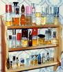 perfumes - assorted perfumes in a cabinet.
reference link: http://upload.wikimedia.org/wikipedia/commons/thumb/0/0a/Perfume_shelf_536pix.jpg/180px-Perfume_shelf_536pix.jpg