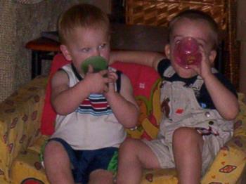 my son with his sippy cup, with a friend and his.  - my son and his friend with thier sippy cups. 