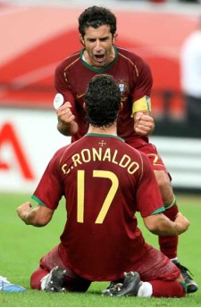 C. Ronaldo and Luis Figo - Cristiano Ronaldo and Luis Figo celebrating a goal.