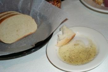 Dipping bread in balsamic vinegar and olive oil - Yummm!  Dipping bread in olive oil and seasonings!