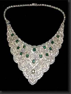 Imelda Marcos Jewels - A diamond choker with 15, 5 cts.each Colombian emeralds, 75 total cts. emeralds, and 50 cts total diamonds set in platinum.