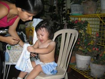 tough love - here&#039;s a picture of my son crying because I interupted his playtime to change his shirt that is soaked with sweat..