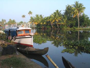 kayal - it is a kayal which a name for backwaters in kerala.a boat in the kayal.