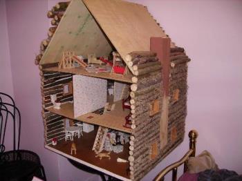 doll house - doll house made out of tree branches.