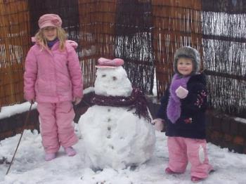 girls and the snowman - My girls standing by the snowman they built.