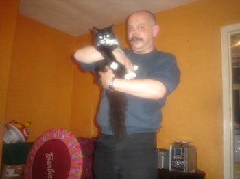 this is my husband and our ball of fluff - this is bob with guinness the first few weeks after he moved in. Lol he grew rather a lot since then. He still is quite mad and im convinced he is &#039;owned&#039; by at least five other families