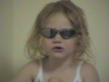 Amy in her first pair of shades. - My granddaughter, Christmas 2003.