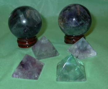 Fluorite Spheres & pyramids - Fluorite is the ultimate stone of Well Being. It provides purification, cleansing, and eliminates that which is in disorder. It works within the physical, emotional, and spiritual systems, bringing a sense of calmness and peace. It&#039;s multi-colors enhance all aspects of well being, notably the purples for wisdom and intuition, and the greens for healing and abundance. 