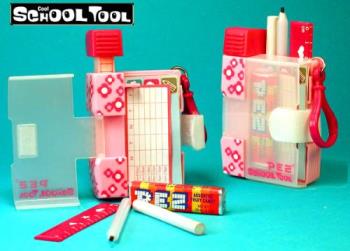 Pez School Tool - Released and retired 2004, the Pez SCHOOL TOOL Candy Dispenser has many COOL features including: 

- Dispenses Pez Candy 
- Note Pad
- Ruler
- Eraser
- Pencil
- Back Pack Clip
- Metric Temperature Converter 
- Metric Distance Converter
