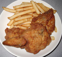 Fried Chicken - Other than fried chicken, many KFC restaurants serve side dishes like coleslaw, various potato-based items (including potato wedges, and mashed potatoes with gravy), biscuits, corn on the cob and, outside of the U.S. french fries and poutine. KFC also offers other entrées such as Popcorn Chicken, pot pies, chicken strips, hamburgers, pork ribs, buffalo wings, sandwiches and desserts — though not all may be found in all locations, particularly in non-U.S.locations. Some sides are available only in a particular region.

