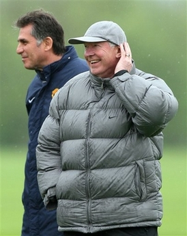 Alex & Carlos - Man Utd&#039;s manager Alex Ferguson and his right hand man, assistant manage Carlos Queiroz look on during a practice session