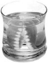 Dentures in a Glass - image of a set of false teeth in a glass for cleaning.