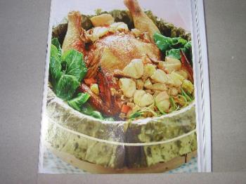 steamed chicken - Delicious steamed chicken in a bamboo steamer laid with lotus leaf.