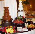 Chocolate Fountain and Fruit - A chocolate fountain with fruit for dipping. Chocolate Fountain and Fruit - A chocolate fountain with fruit for dipping.