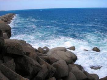 Ocean - A scenic view of a rocky port.