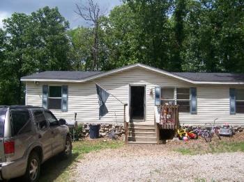 My Home - This is a photo of my home...set in the countryside with lots of trees and fresh air...in rural Arkansas...