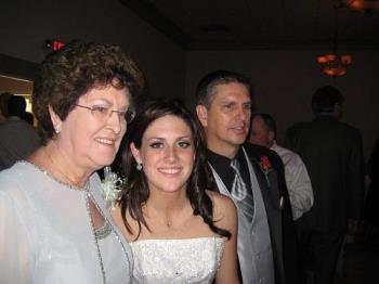 Picture taken at wedding - My sister took this picture of me, my granddaughter and my son. Her picture turned out so much clearer than mine did. 