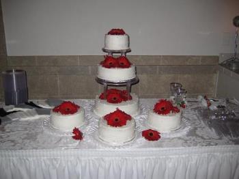 Wedding Cake(s) - My granddaughter&#039;s wedding cake(s) which were decorated with the same flowers carried by the bridesmaids and maid of honor.