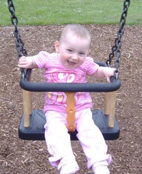 baby girl thorougly enjoying a swing. Doesn&#039;t she  - baby girl thorougly enjoying a swing. Doesn&#039;t she look happy?