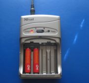 Rechargeable Batteries - A charger with rechargeable batteries