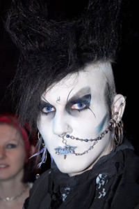 A German goth - A German Goth, a so-called "Gruftie", with rosary beads and alchemical symbol on forehead. A German goth - A German Goth, a so-called "Gruftie", with rosary beads and alchemical symbol on forehead.