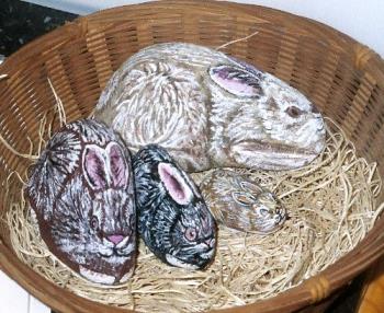 Basket of Bunnies - Several rocks I have painted in acrylics to look like bunnies. I call them E-Z pets! All they ever need is dusting!