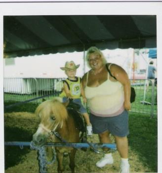 Skylar and me:) - This is Sky riding a horse at a fair:)