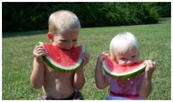 my watermelon eating cuties - Boy do they love watermelon. We always eat it outside because they make such a mess. Their sticky sweet kisses are so good afterwards.