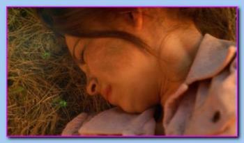 Kristin Kreuk - Kristin Kreuk as Lana Lang in Smallville "Sbscura" after the explosion and unconscious among meteor rock fragments.