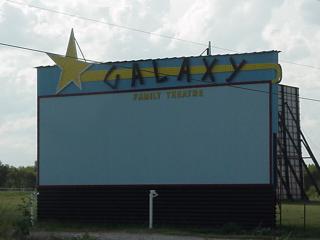 A drive in  - I remember the drive in when I was a kid. It was a cheap form of going to the movies. 