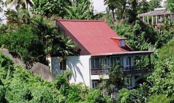 House - A very beautiful house surrounded by green.