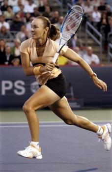 Martina Hingis - Martina Hingis always wears appropriate clothes whaen playing tennis.