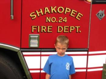 Grandson - Enjoying ythe fresh air as wll as the firetruck Grandson - Enjoying ythe fresh air as wll as the firetruck