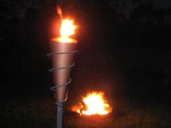 Tiki Torch and Bonfire - Tiki torch in foreground with my bonfire going