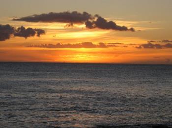 Sunset in Hawaii - This was taken with a Canon Powershot A530 without a tripod. I used the Auto Mode and focused just below the sun to make the under expose the photo and bring out the color more.