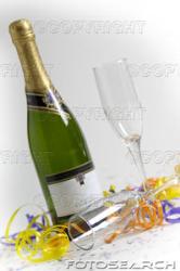 Champagne Bottle And Glasses - Champagne bottle with glasses waiting to be filled.