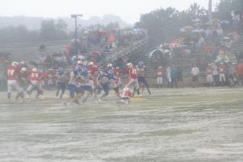 Football game in the rain - This photo was taken during a rain storm where we received 1 inch in less than an hour. Shortly after this photo was taken the game was posponed for about 45 minutes - very unusual for a football game.