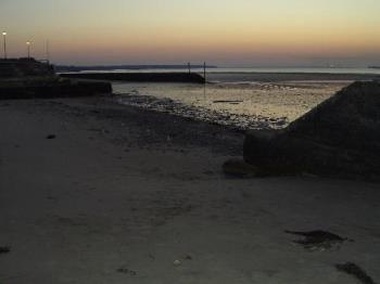 Sunset Over Ryde Beach - The view over to Portsmouth from Ryde Sea front at sun set Sunset Over Ryde Beach - The view over to Portsmouth from Ryde Sea front at sun set