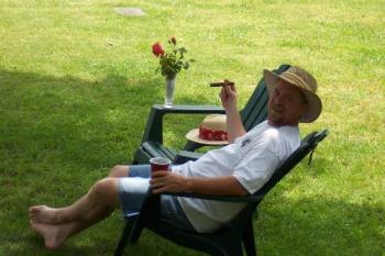 My husband relaxing in our yard. - My husband relaxing in our yard. 