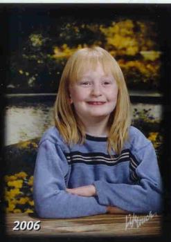 My daughter at 7yrs. - This is my daughter's spring picture from a couple years ago. Notice the background compared to the usual plain ones from the fall class pictures that are normally taken. Each year the background is different. These pics cost a lil more than the fall pics but are worth it to me. My daughter at 7yrs. - This is my daughter's spring picture from a couple years ago. Notice the background compared to the usual plain ones from the fall class pictures that are normally taken. Each year the background is different. These pics cost a lil more than the fall pics but are worth it to me.