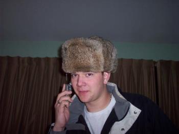 My son modeling a hat - This is my son - wearing a mad bomber hat...he does not care if he looks odd.