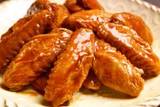 chicken - The photo displays a platter of buffalo wings.