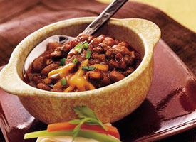 Slow cooker SalsaChili - Bowl of salsa chili cooked in Crock pot Slow cooker SalsaChili - Bowl of salsa chili cooked in Crock pot
