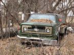 juck truck - a junk truck in a field