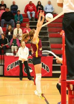 An Action shot of a volleyball game - This was taken with a Canon Digital Rebel using a 5mm F1.8 lens. The ISO was set at 1600 and I used only available light.